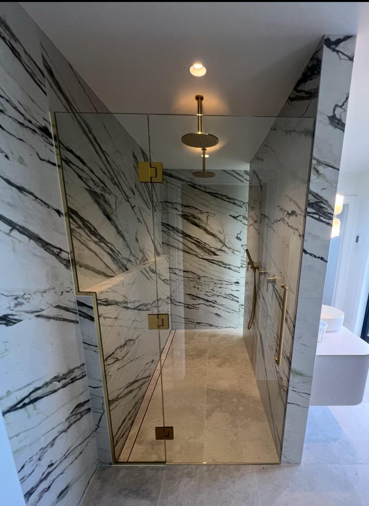 glass shower marble walls